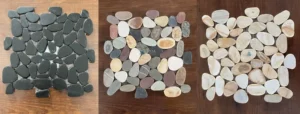 Three pebble mosaic sheets side by side: black sliced pebble, mixed-colour river pebble and tan and white river pebble